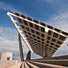 [UNVERIFIED CONTENT] A low angle view of the large Photovoltaic (PV) Pergola designed by Torres & Lapena and erected in 2004, being used to harvest renewable energy (solar power)at El Forum in Barcelona. Overlooking the beach, it is also a popular hang-out for local skateboarders.