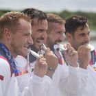 Tokyo (Japan), 07/08/2021.- (L-R) Silver medalists Marcus Walz, Saul Craviotto, Carlos Arevalo and Rodrigo Germade of Spain bite their medals during the Men's Kayak Four 500m Finals awarding ceremony at the Tokyo 2020 Olympic Games at the Sea Forest Waterway in Tokyo, Japan, 07 August 2021. (Japón, España, Tokio) EFE/EPA/FRANCK ROBICHON