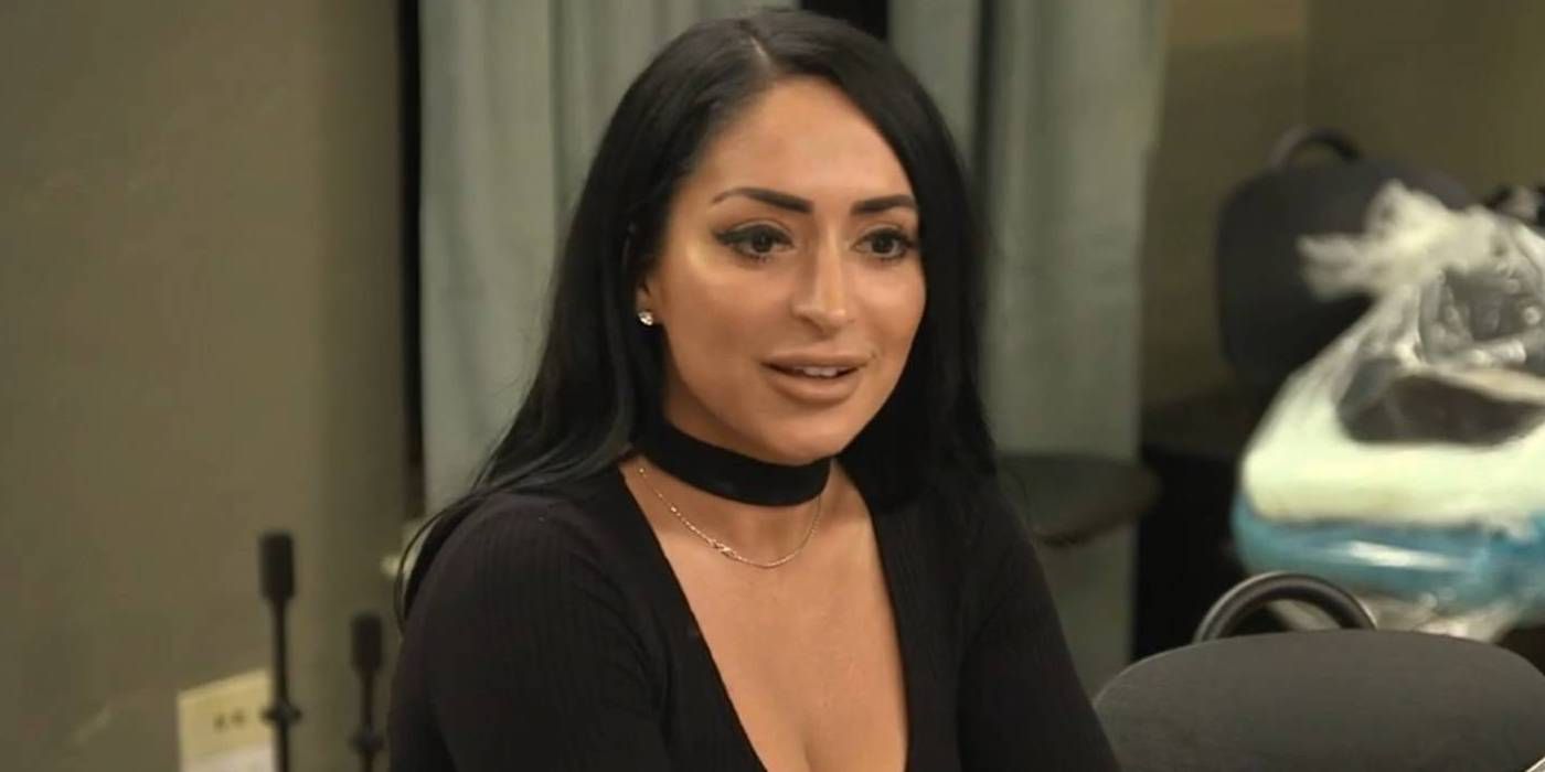 Jersey Shore's Angelina Pivarnick after entering house for first time wearing black outfit smiling