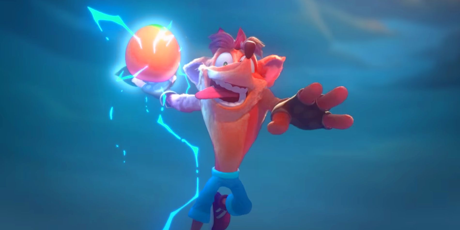 Image from the Crash Team Rumble trailer featuring Crash Bandicoot holding a Wumpa fruit encased in lightning as if he's about to slam dunk it into a basket. While wearing his trademark pants and his tongue hanging out.
