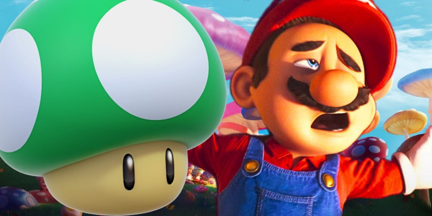 mario is defeated laying next to a green 1-up mushroom
