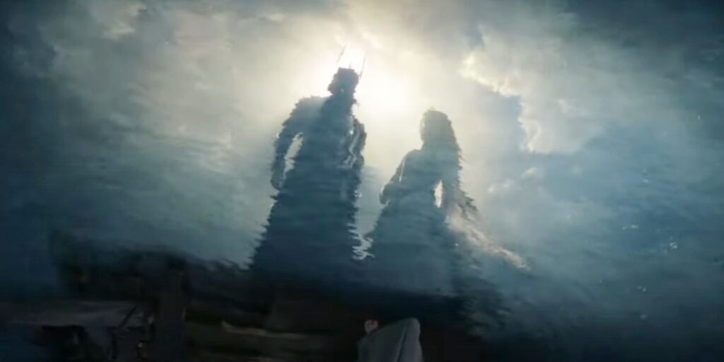 Sauron and Galadriel looking at reflections in the water