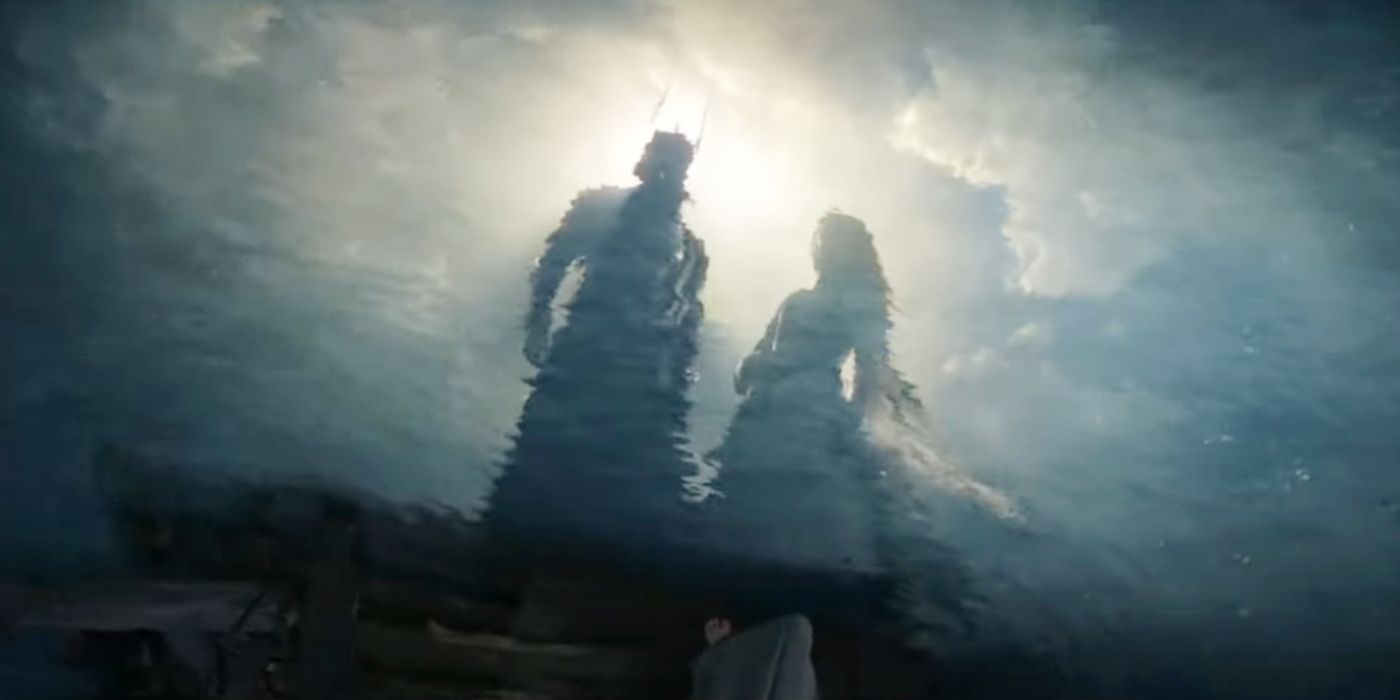 Sauron and Galadriel looking at reflections in the water