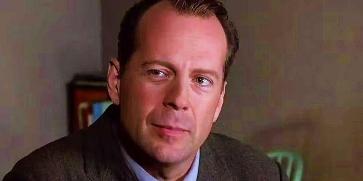 Bruce Willis as Malcolm smiling slightly in The Sixth Sense