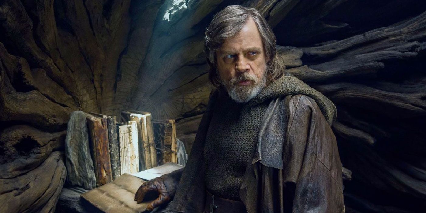 Mark Hamill's Luke Skywalker stands in front of the sacred Jedi texts