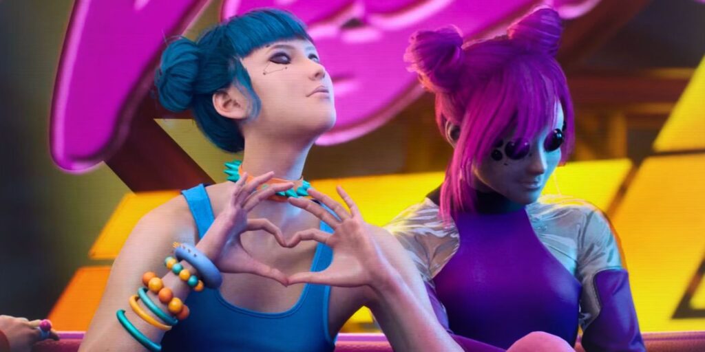 Blue Moon and Purple Force from Cyberpunk 2077 band Us Cracks, sitting side by side. Blue Moon is making a heart with her hands.