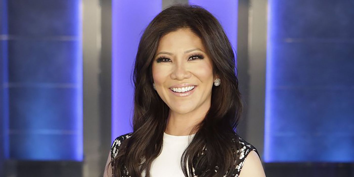 Close up of Big Brother host Julie Chen smiling in front of house