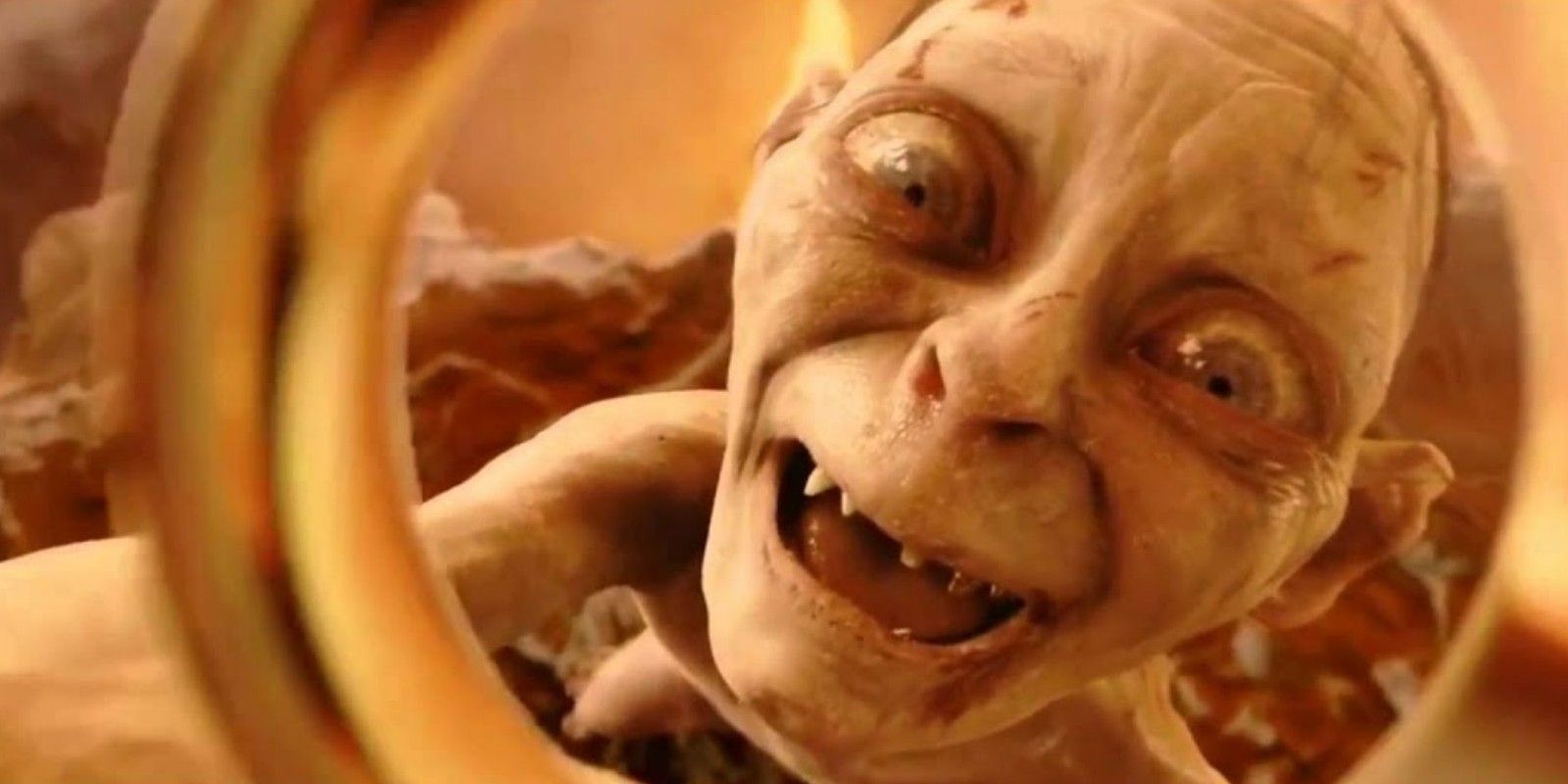 Gollum holding up the One Ring in Lord of the Rings.