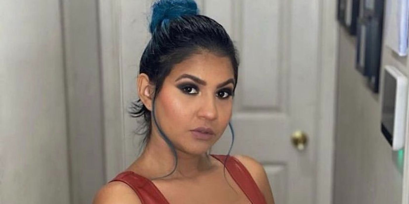 Karine Martins Staehle from 90 Day Fiancé hair in bun glam makeup posing inside house