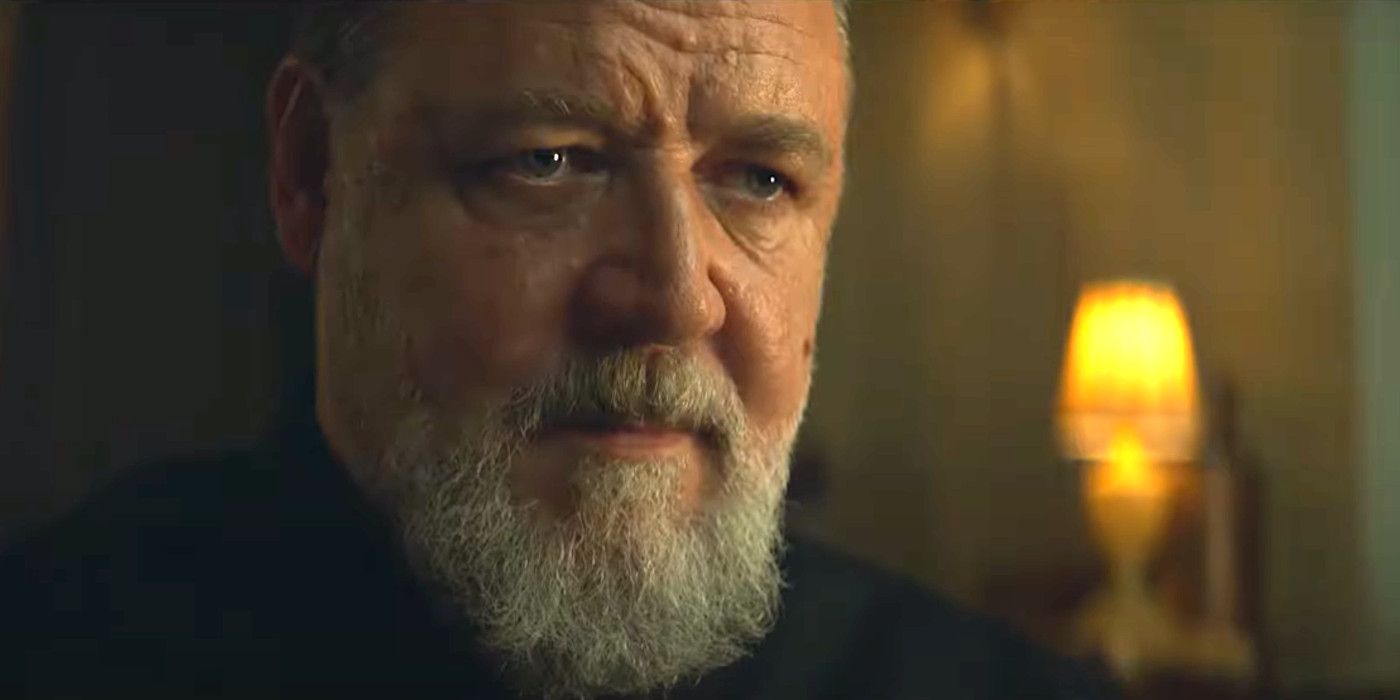 Russell Crowe as Father Amorth in The Pope's Exorist making a very serious face in a dimly lit space