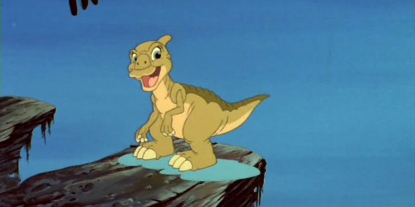 Ducky looks happy while standing on a rock in Land Before Time