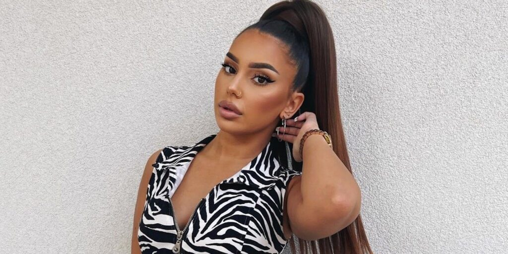 Miona Bell from 90 Day Fiancé wearing zebra print top