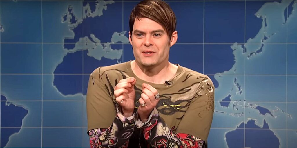 Bill Hader as Stefon on Saturday Night Live looking nervous against the backdrop of a world map
