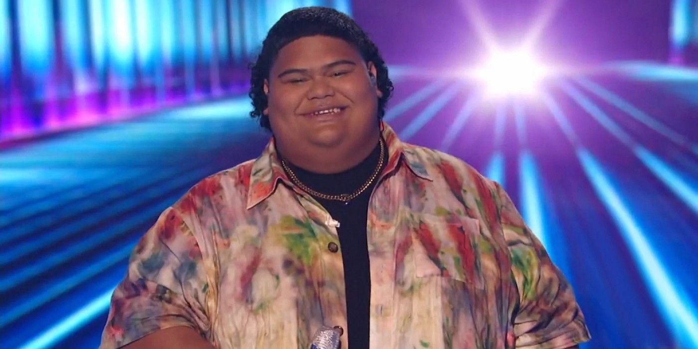 American Idol Iam Tongi Smiling in printed shirt smiling blue background