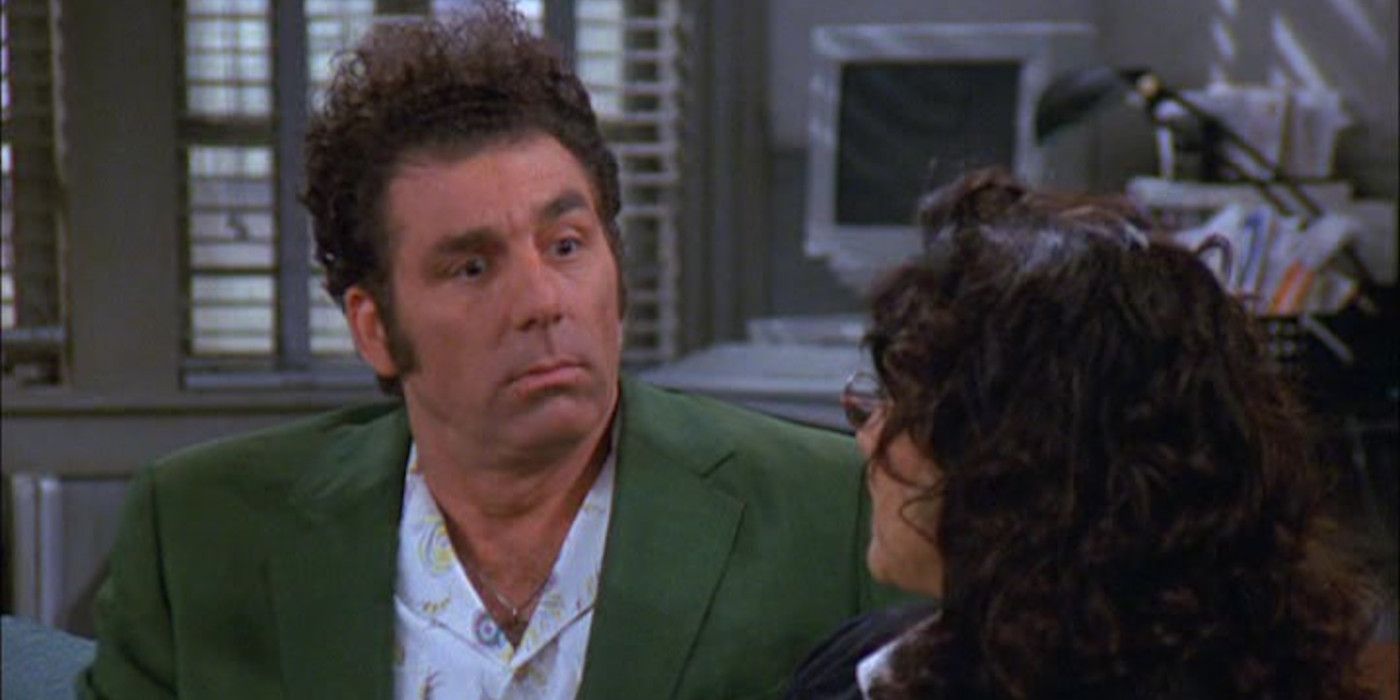 Kramer en Seinfeld expresando conmoción y consternación mientras está sentado en el sofá frente a Elaine