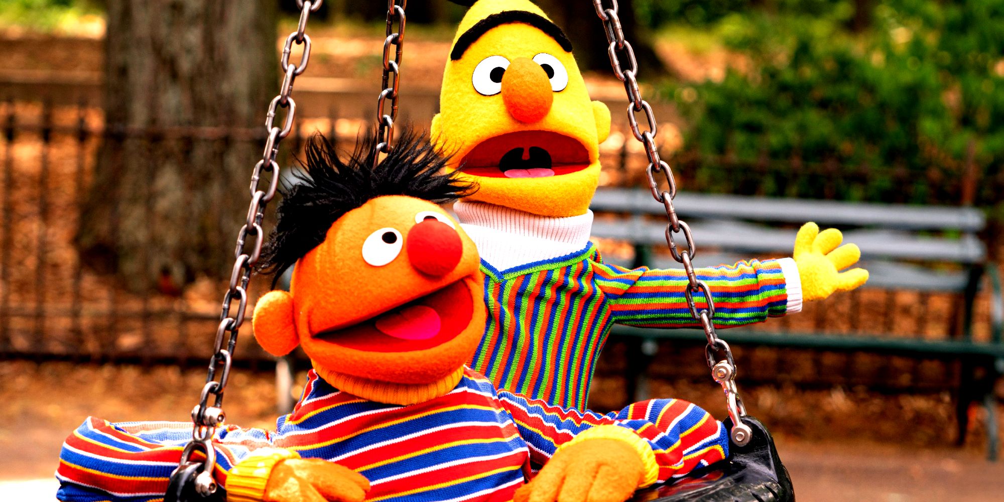 Sesame Street's Bert and Ernie riding in tire swing together