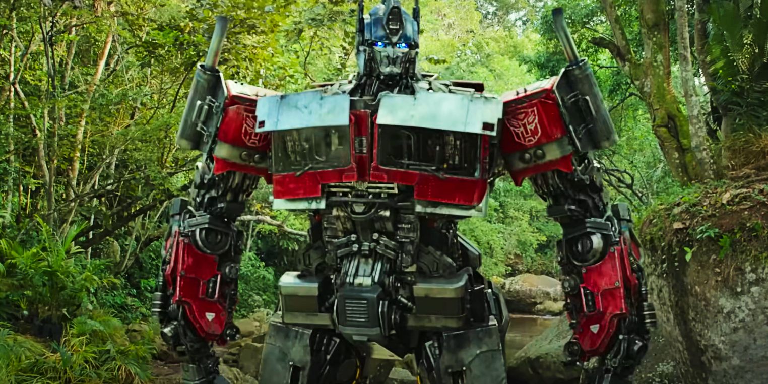 Optimus Prime standing in the forest in Transformers Rise of the Beasts
