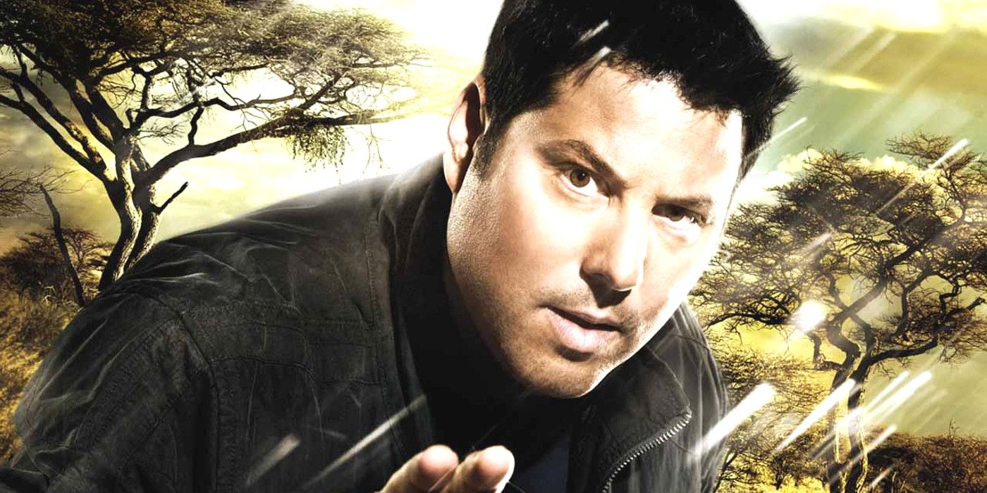 Greg Grunberg in Heroes posing heroically in the rain against a forest backdrop