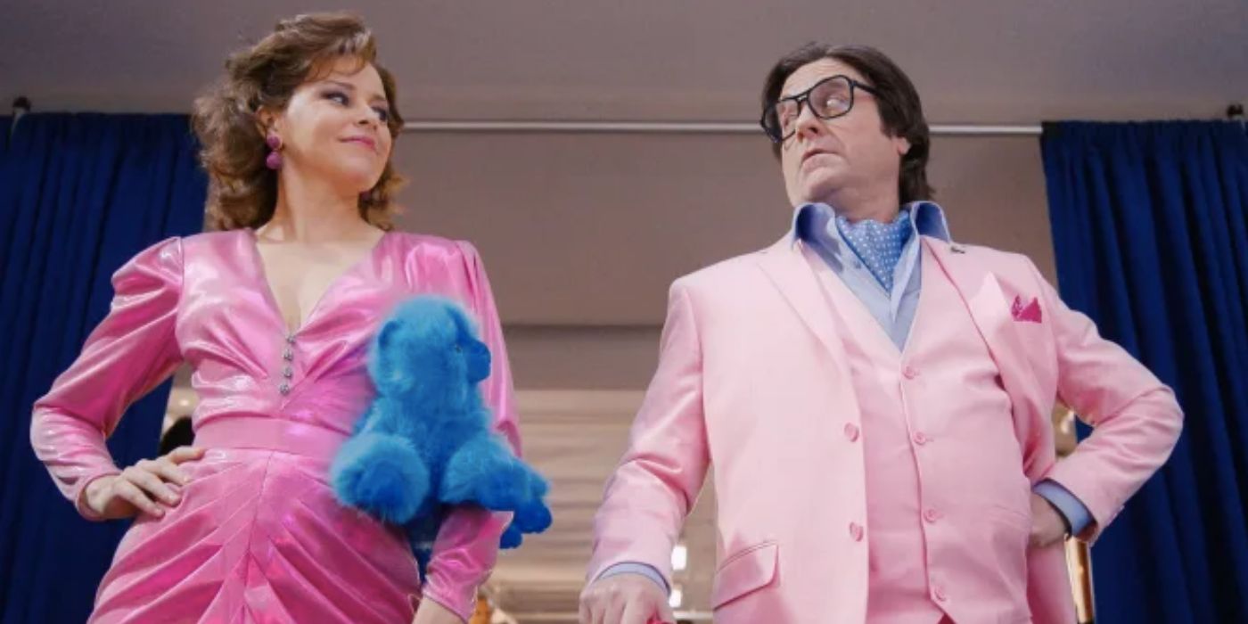 Elizabeth Banks and Zach Galifianakis wearing all pink in Beanie Bubble