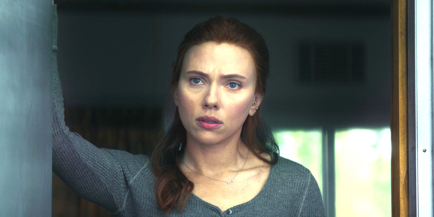 Scarlett Johansson as Natasha in Black Widow standing in a doorway looking mildly concerned