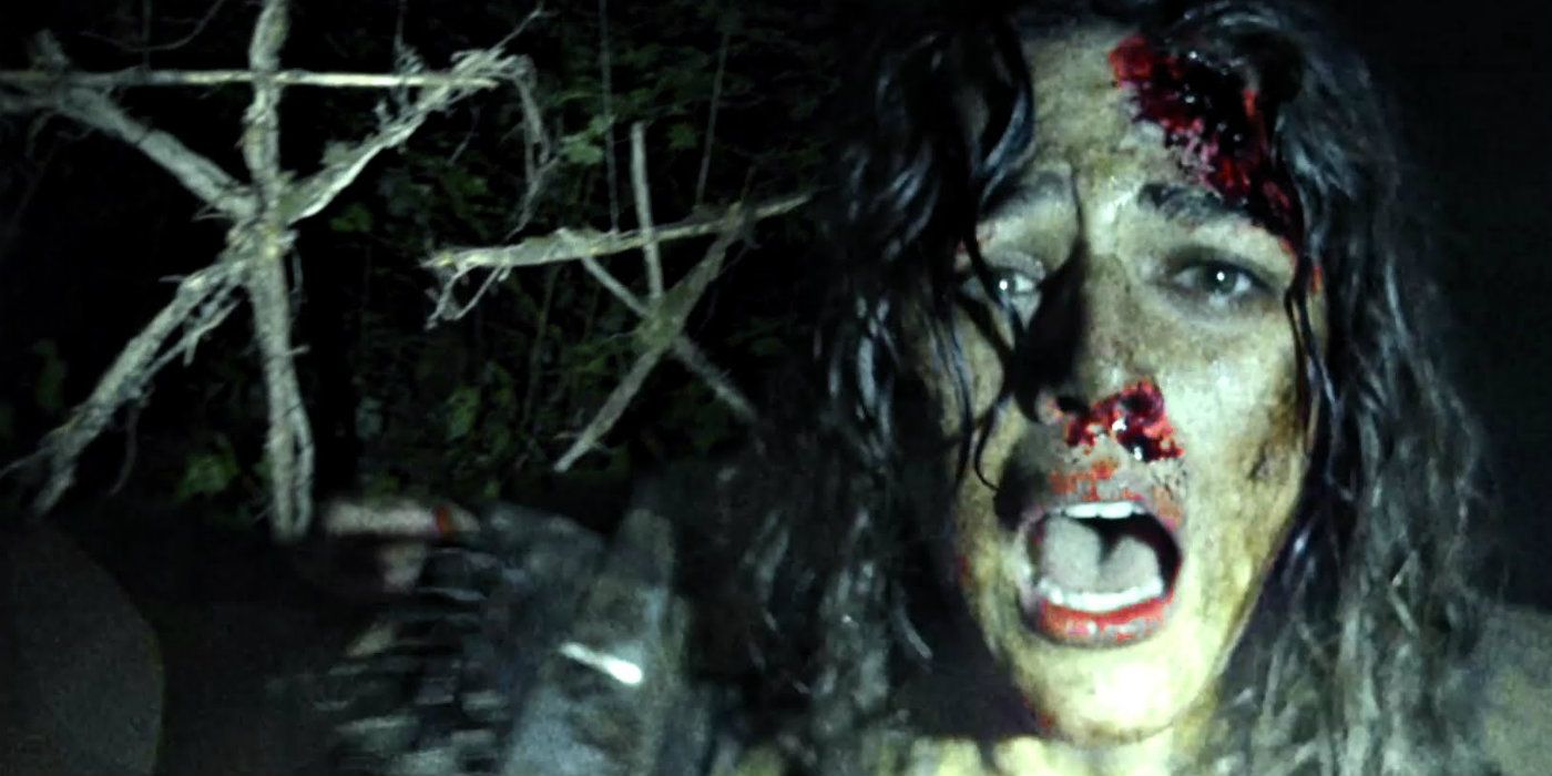 Lisa bloodied next to Blair Witch symbols in Blair Witch 2016
