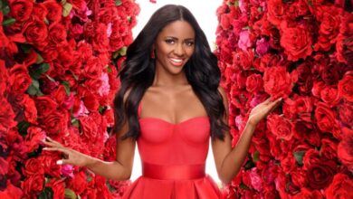The Bachelorette's Charity Lawson in red dress in front of roses
