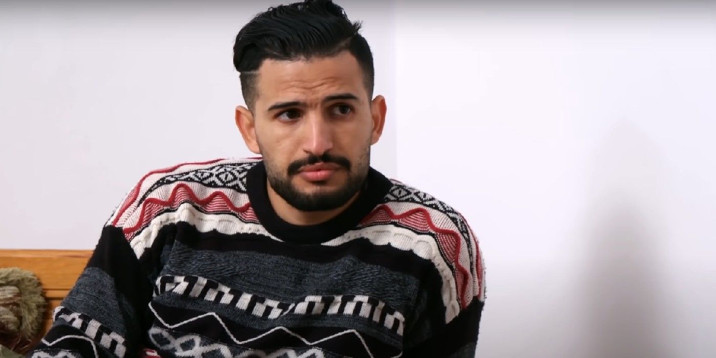 Hamza Moknii from 90 Day Fiance: Before the 90 Days season 5 in a multicolored sweater