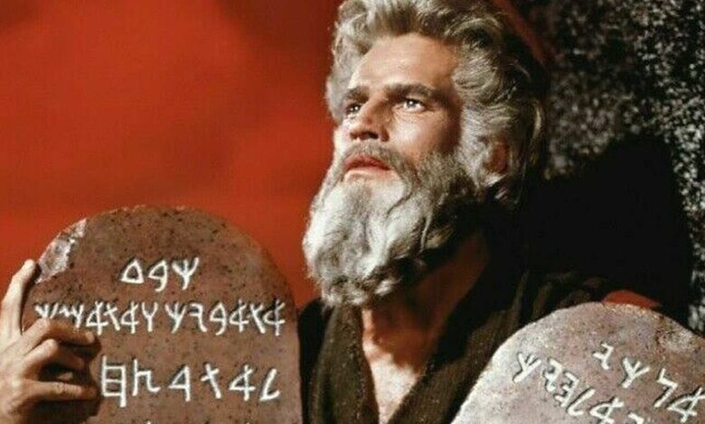 Charlton Heston as Moses holding the ten commandments in The Ten Commandments