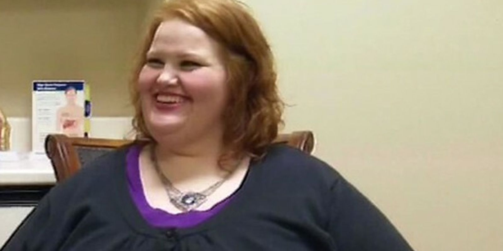 Nikki Webster My 600 Lb Life wearing black top and necklace smling