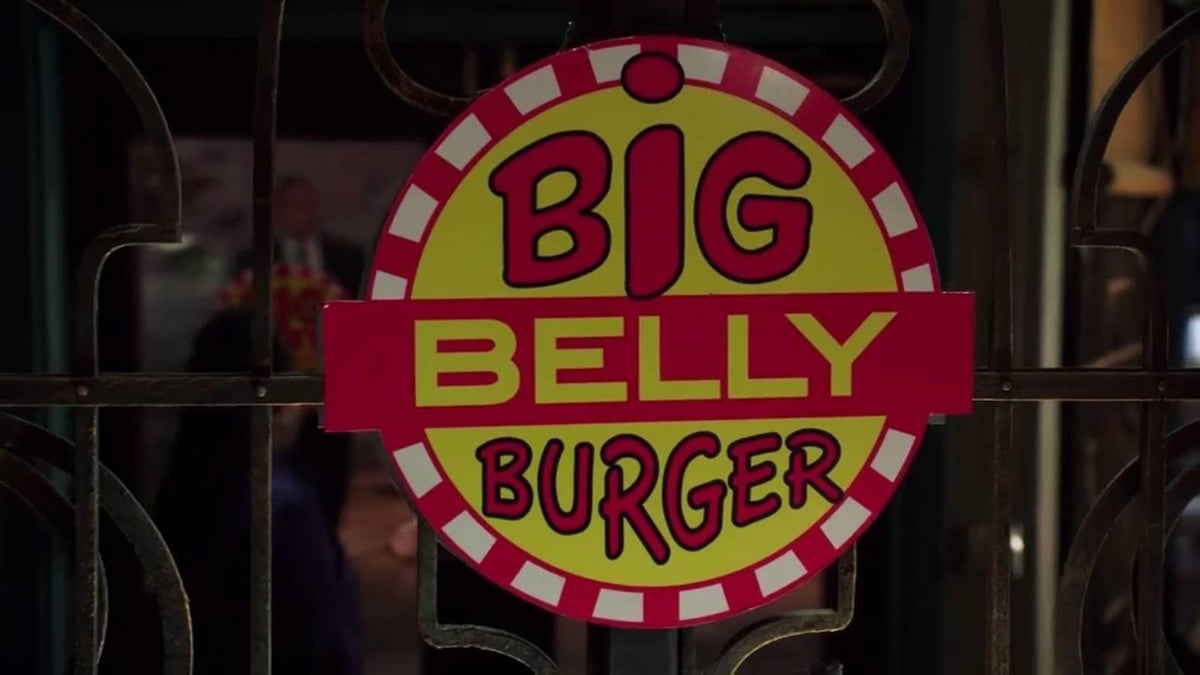 Nuevo cartel de Blue Beetle se burla de Big Belly Burger